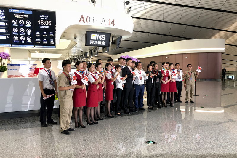 Cabin crew gathered in an airport terminal